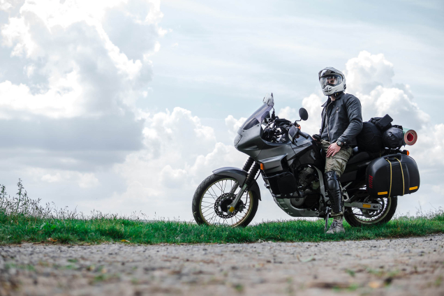 motorbike and biker at side of the road